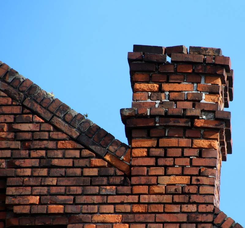 Signs Your Naperville Home Needs a Chimney Inspection Damaged chimney on an Naperville home showing cracks and missing mortar